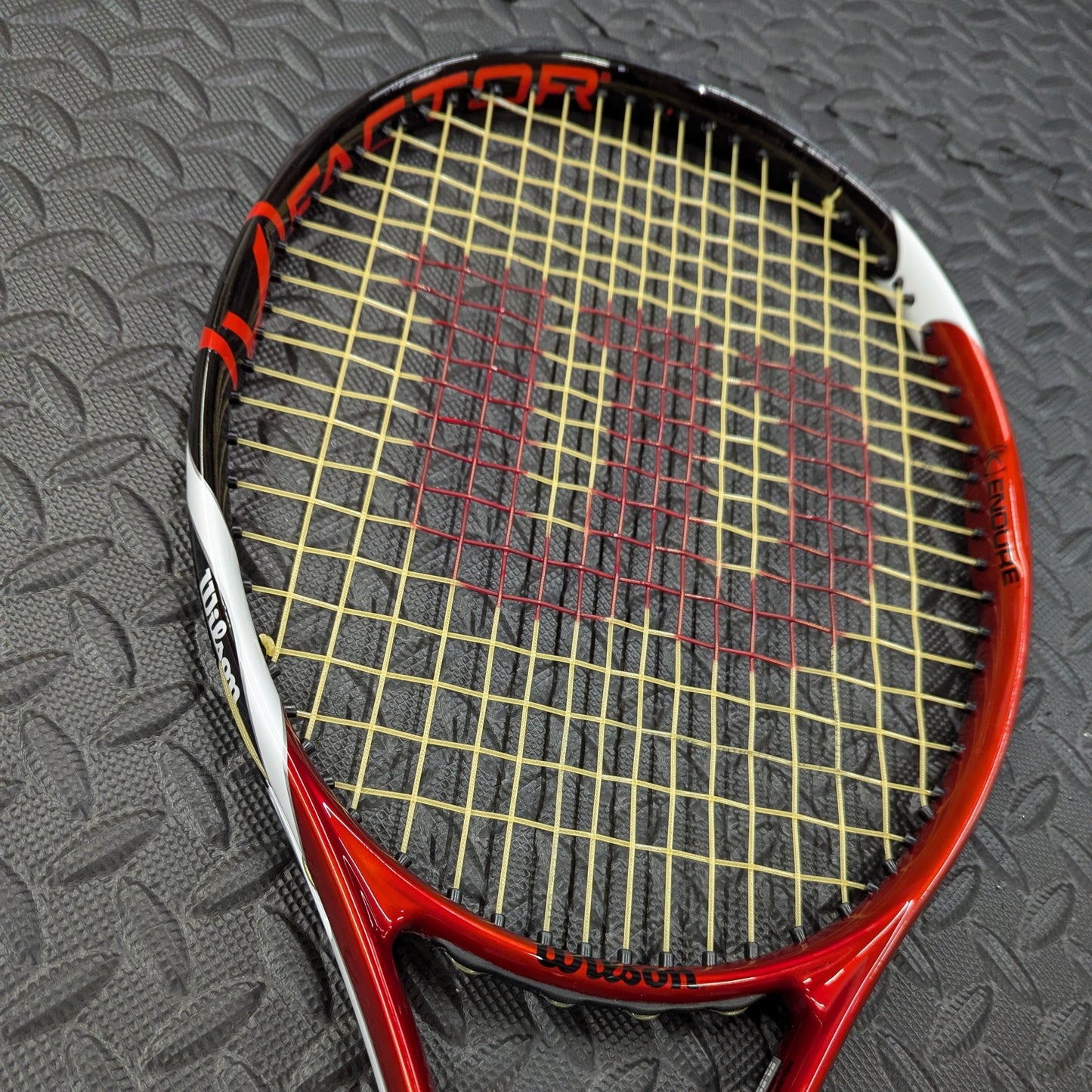 Wilson Tennis Racket restrung with Tecnifibre synthetic gut string in yellow with red stencil